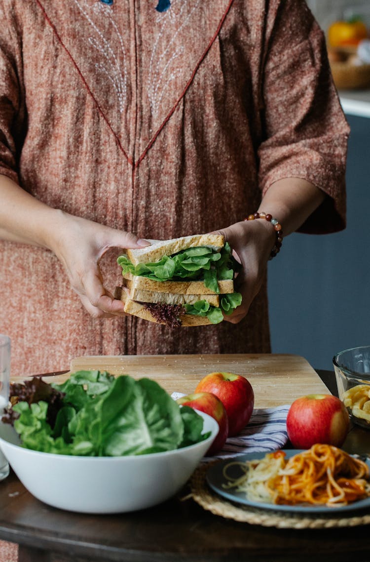 Crop Woman Making Sandwich In Kitchen