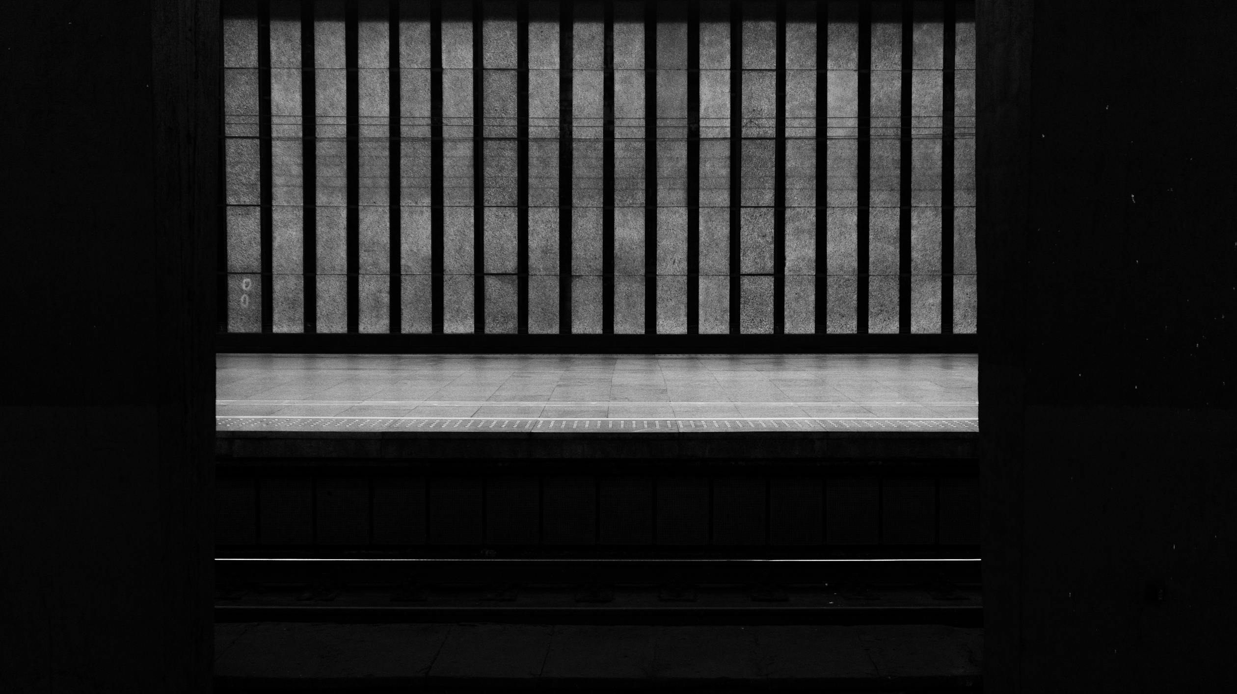 Railway Platform with Black Metal Railings · Free Stock Photo