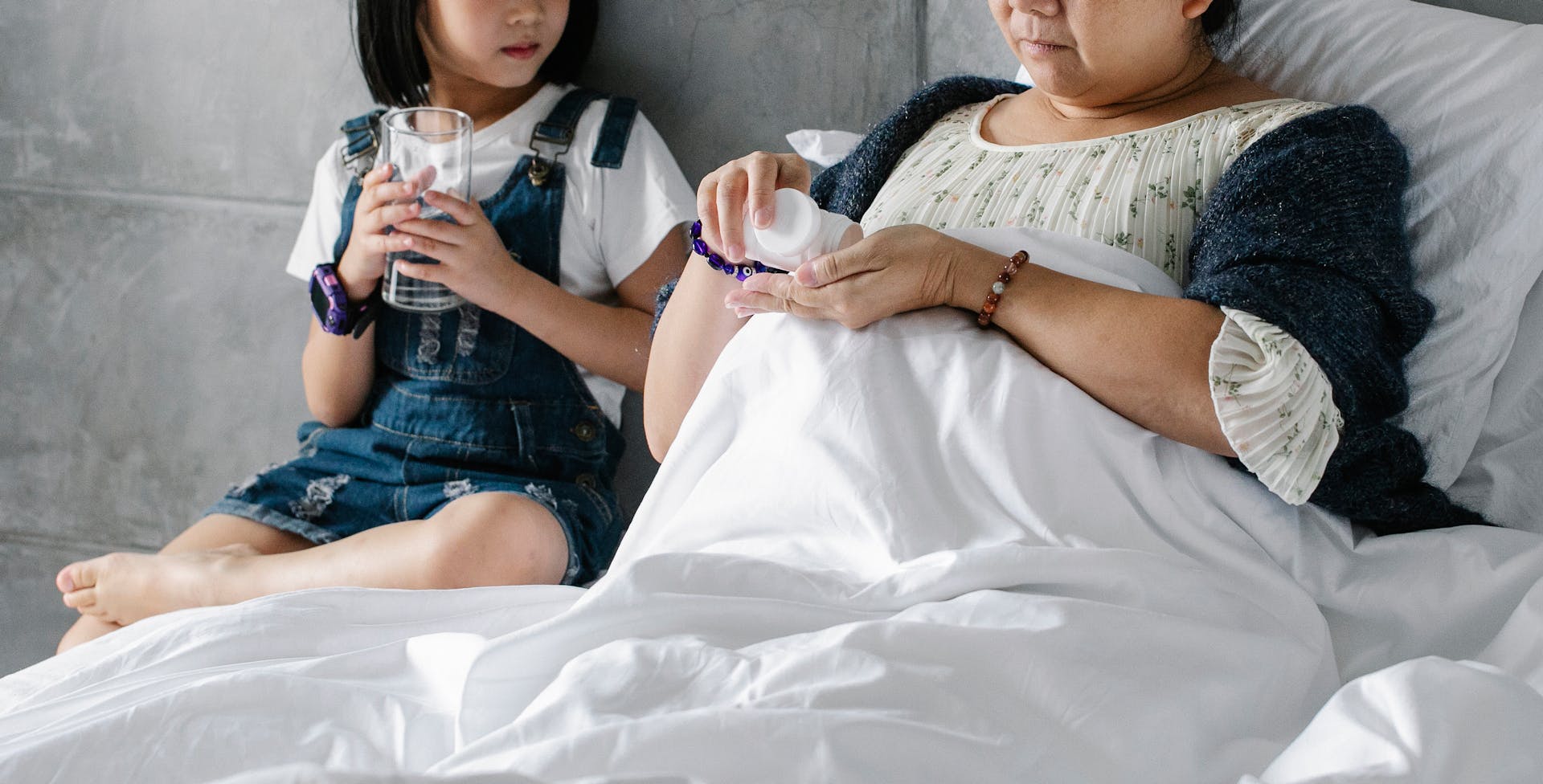 Mother and daughter bonding over healthcare support, indoors and cozy.