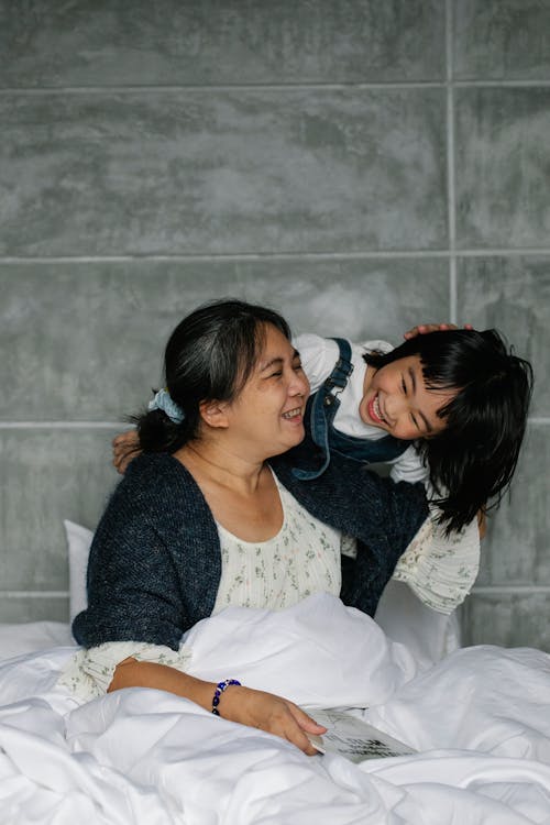 Free Mother and Child on the Bed Stock Photo