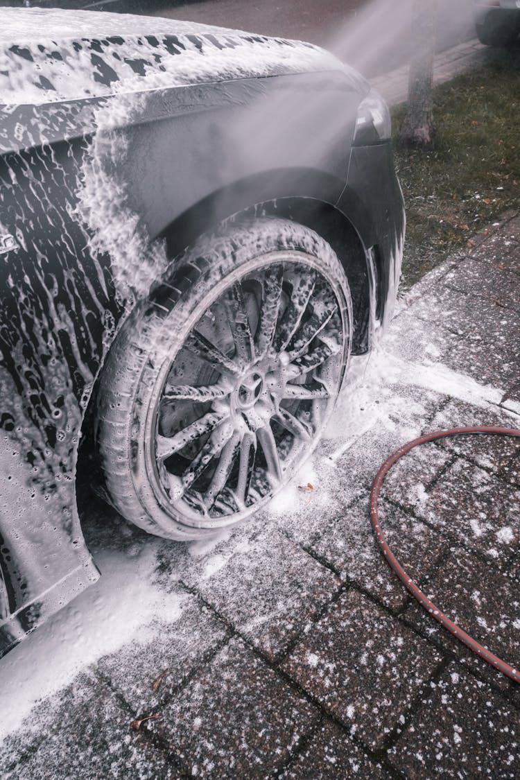 Luxury Car In Foam On Outdoor Wash