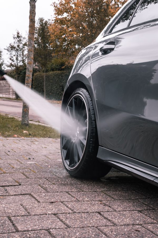 Pressure washing a concrete driveway clean