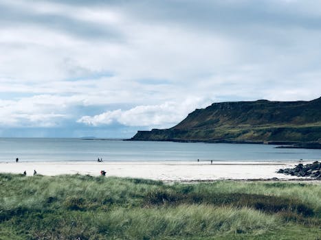 Beautiful beach scene on the Isle of Mull, Scotland with clear skies and coastal views.
