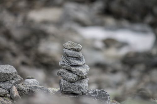 Selective Focus Photo of a Stack of Stones