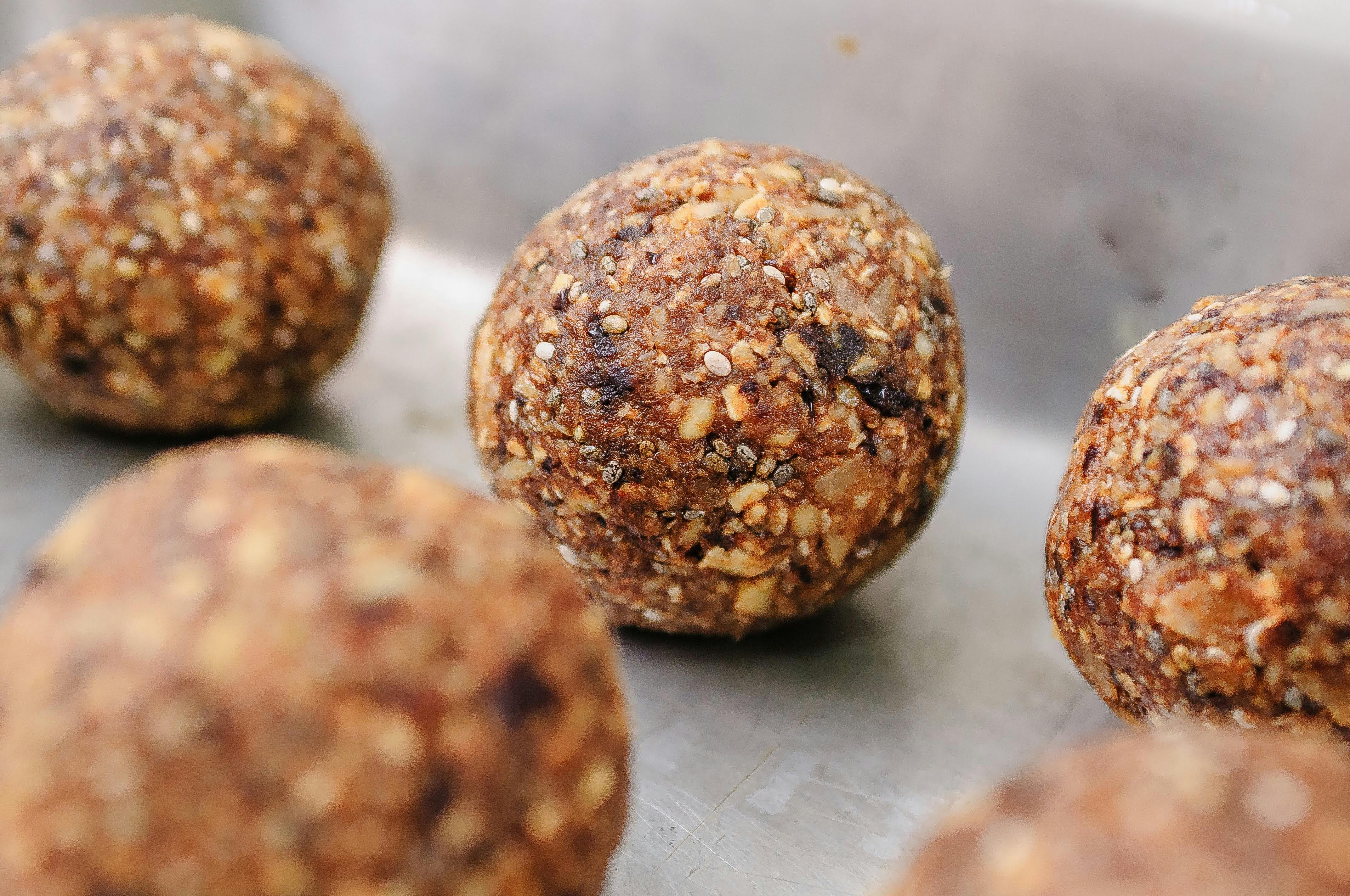 Chopped leafy greens and vegetables being added into a stew pot