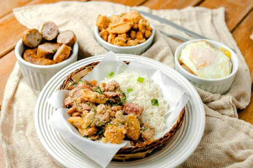 Toothsome dish of fried sausages served with rice