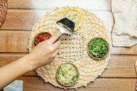 Person putting vegetable salads into tartlet