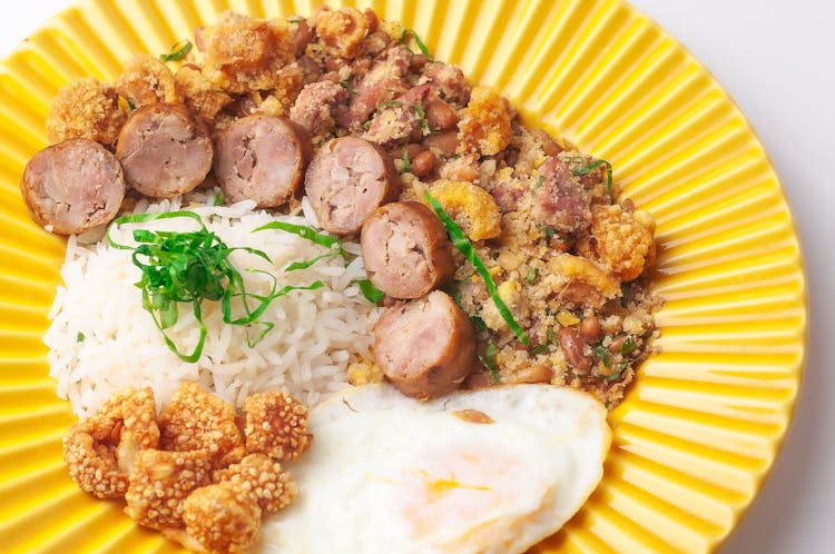 Sliced Sausages With Rice And Fried Egg