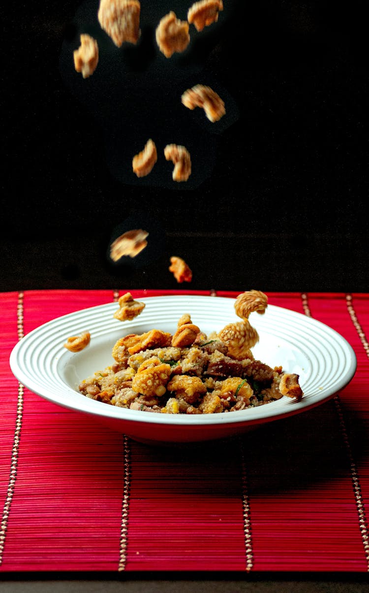 Crispy Corn Falling In Plate On Desk