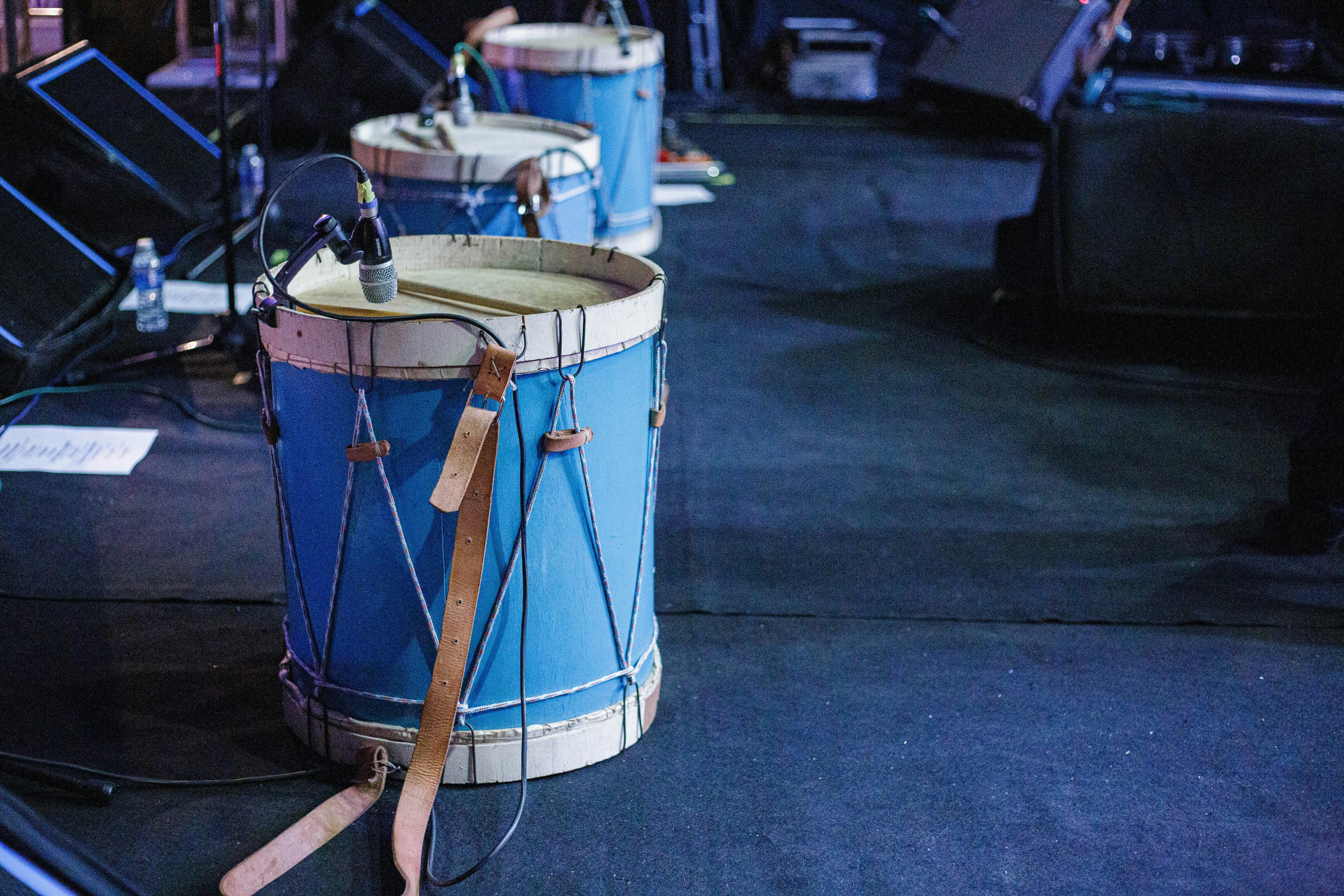 acoustic drum set with microphones on stage