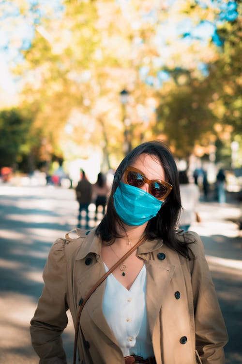 Woman with Sunglasses Wearing a Face Mask