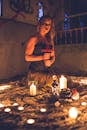 Dark woman with candles doing ritual