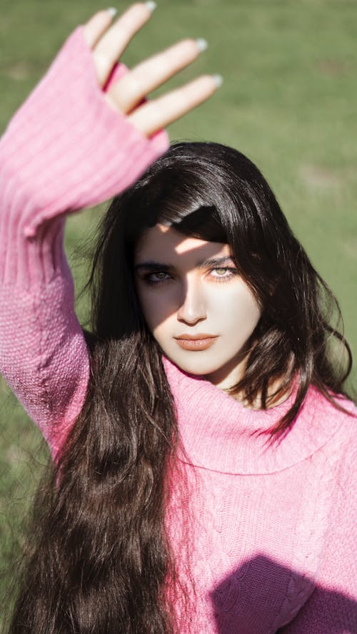 Close-Up Shot of a Pretty Woman in Pink Knitted Sweater 