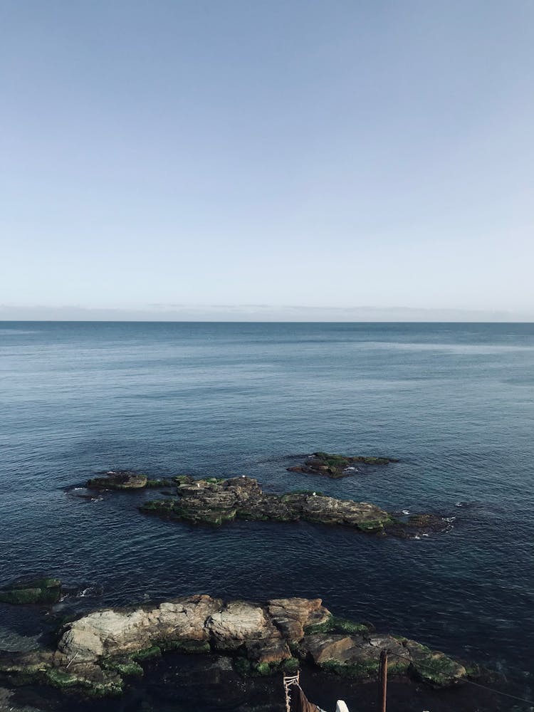 Small Stone Islands In Blue Ocean