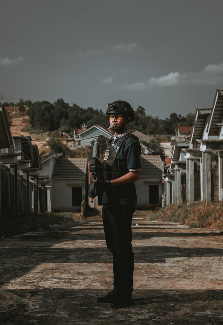 Soldier Holding Gun And Smoking Cigarette