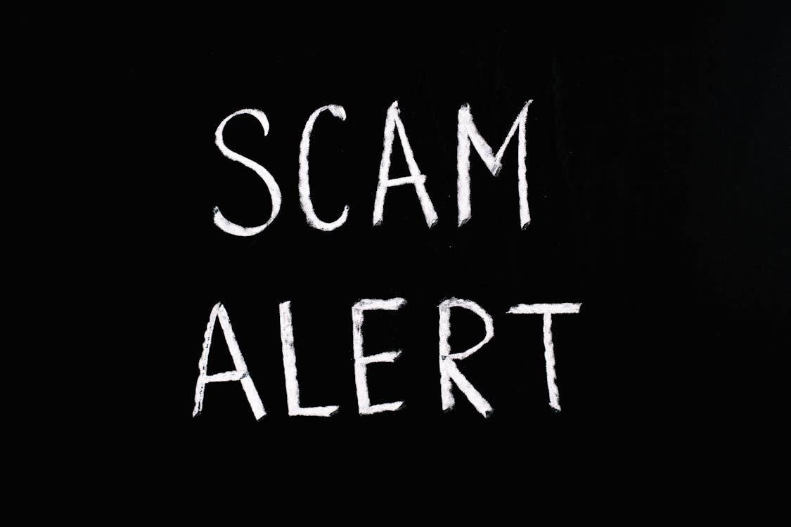 Free Scam Alert Letting Text On Black Background Stock Photo