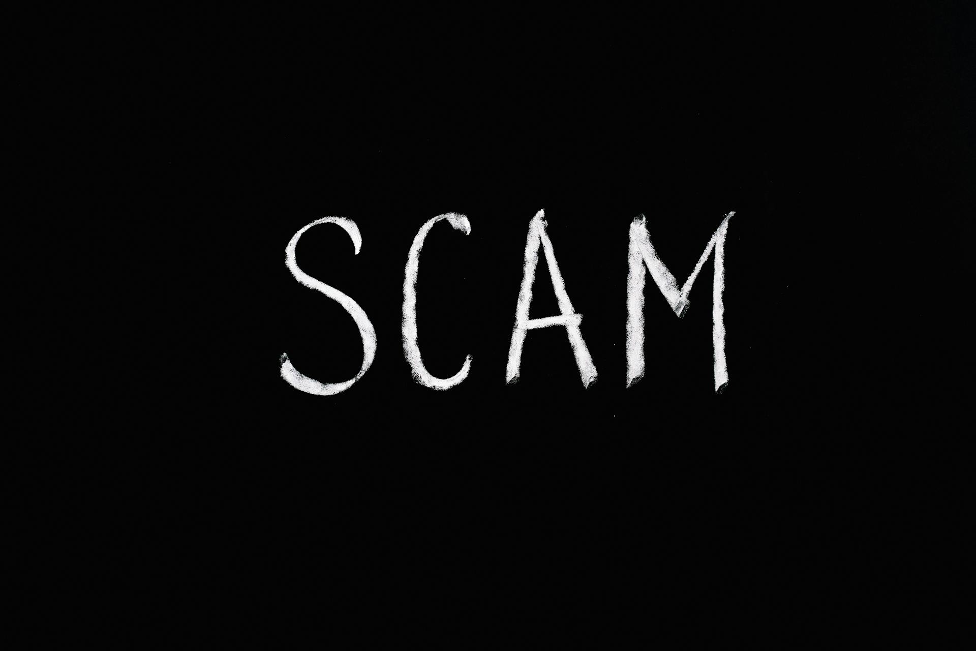 Scam Lettering Text on Black Background