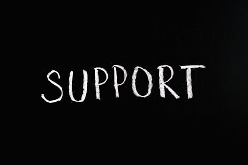 Free Support Lettering Text on Black Background Stock Photo