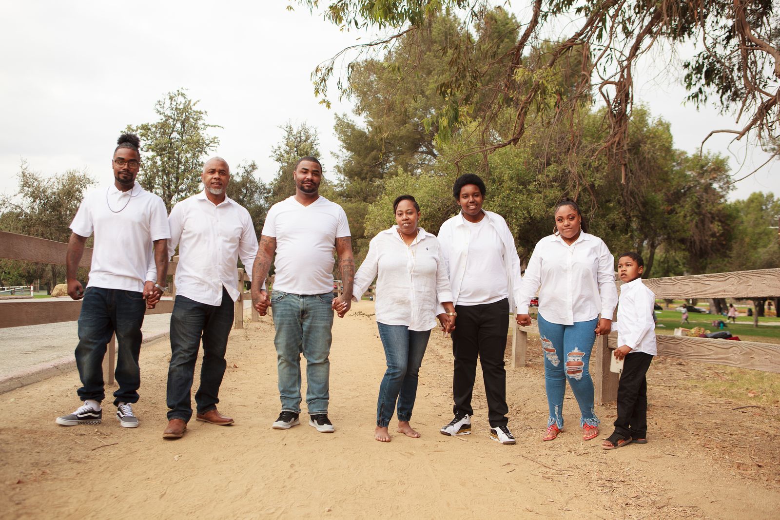 Smiling members of a partner organization celebrating together outdoors