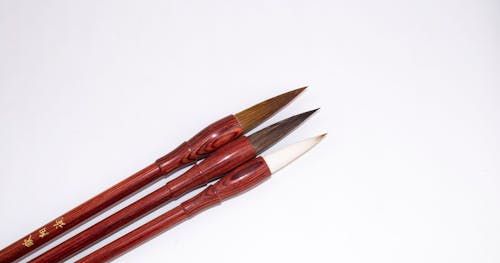 From above of set of professional Japanese calligraphy brush pens with bamboo shafts and soft tips