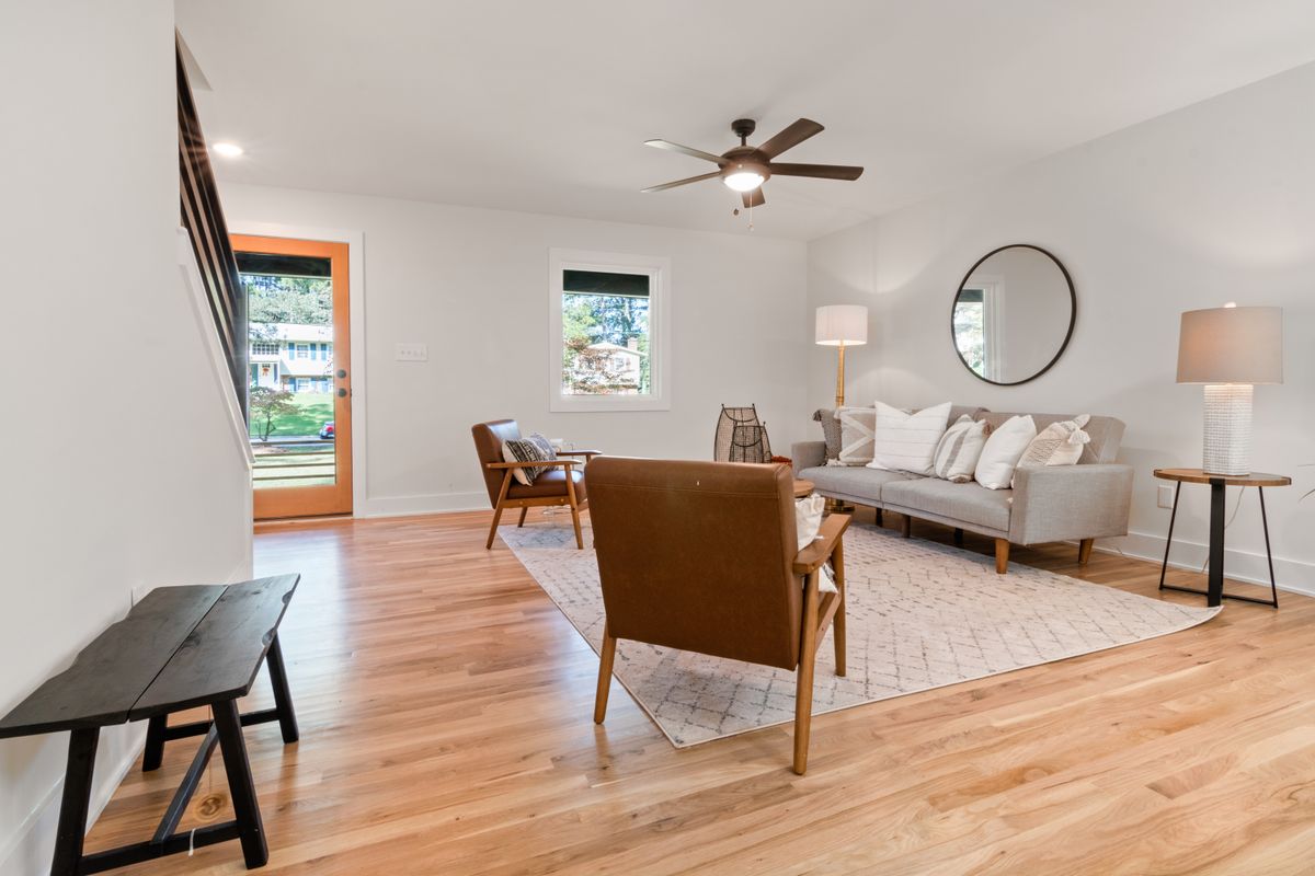 Contemporary living room with solid wood flooring