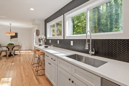 Kitchenette counter with bar stools — photo by Curtis Adams on Pexels