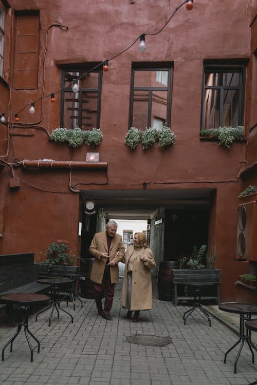 Man and Woman Walking on the Street