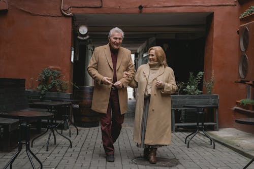 Elderly Couple Walking on the Street