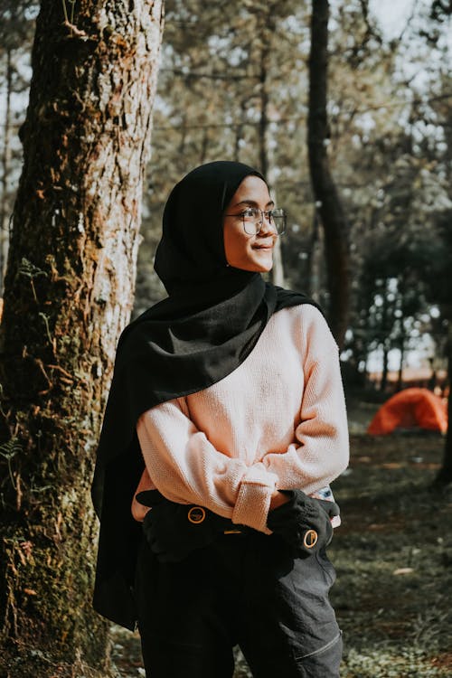 A Woman in Pink Sweater Wearing a Hijab