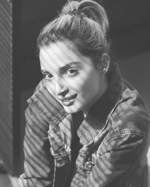 Grayscale Photo of a Pretty Woman in Denim Jacket