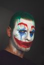 Man with spooky clown makeup