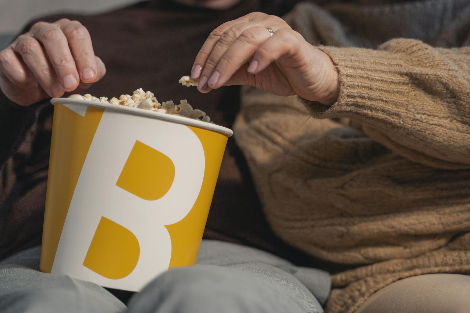 people Having a Bucket of Popcorn