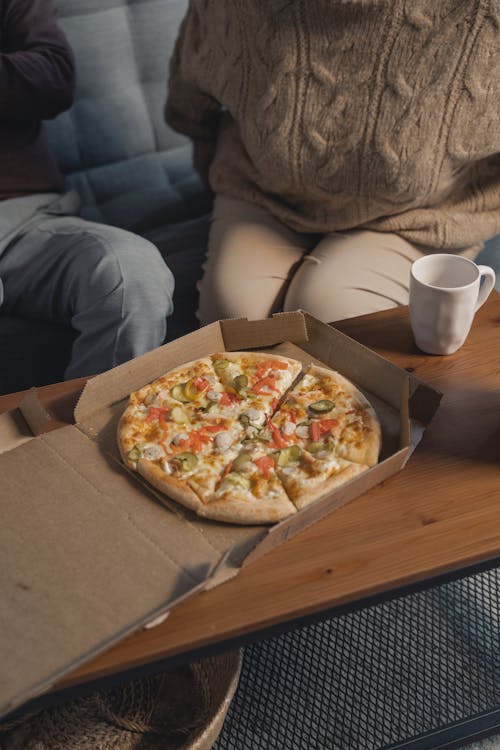 Free A Pizza in a Box over the Table Stock Photo
