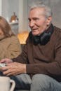 Man in Brown Sweater Sitting Beside Woman in Brown Sweater