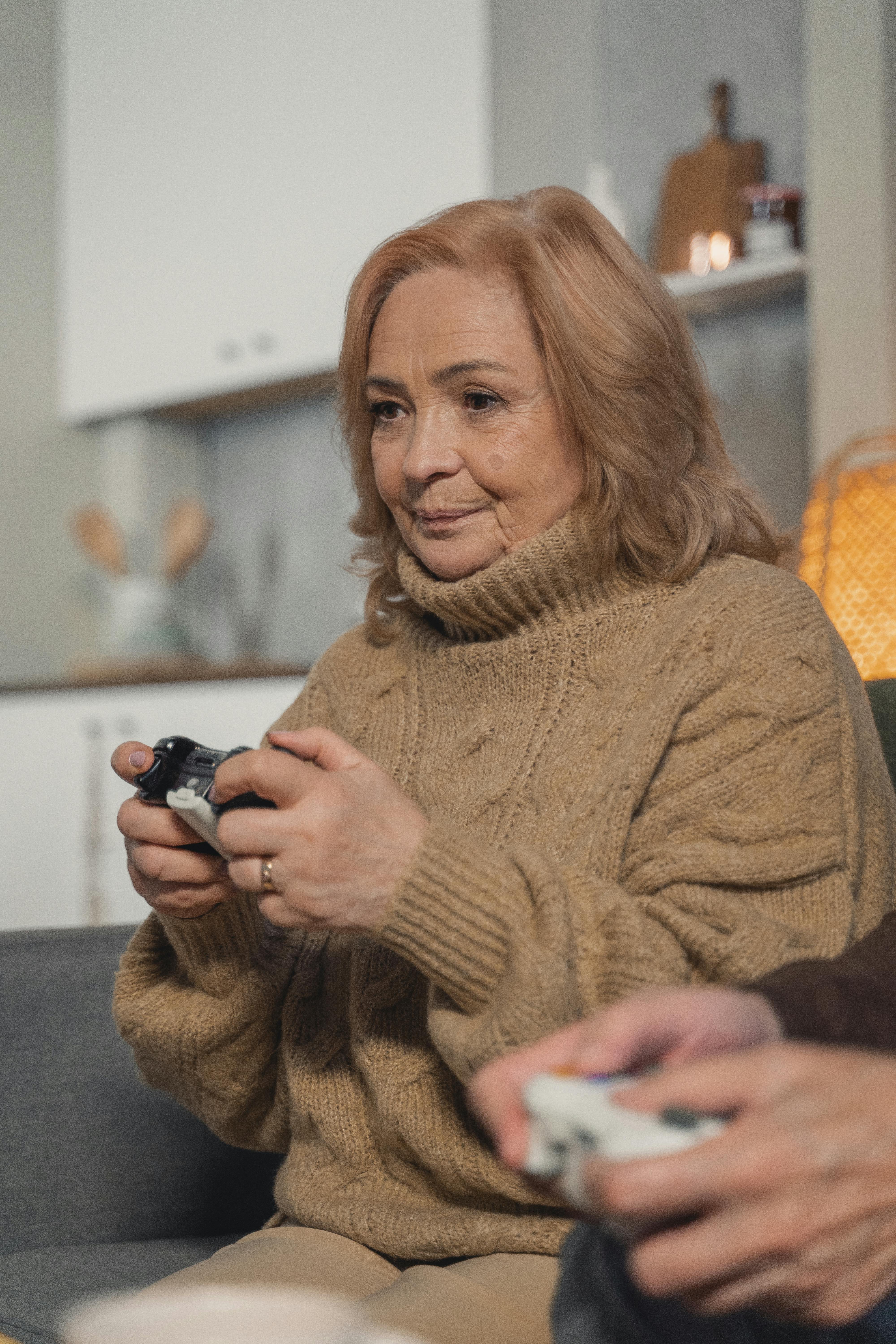 elderly woman playing video games