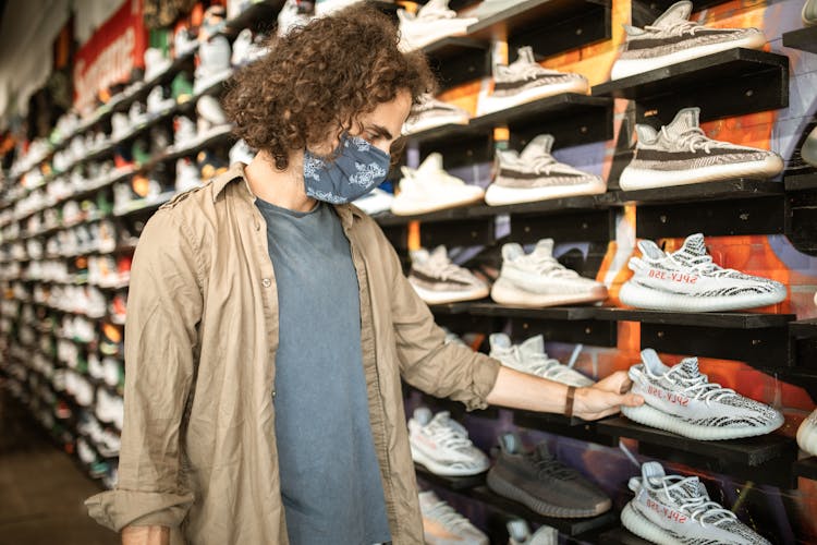 A Man Shopping For Adidas Yeezy Boost