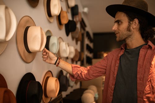 Man in Red Dress Shirt and Black Cowboy Hat