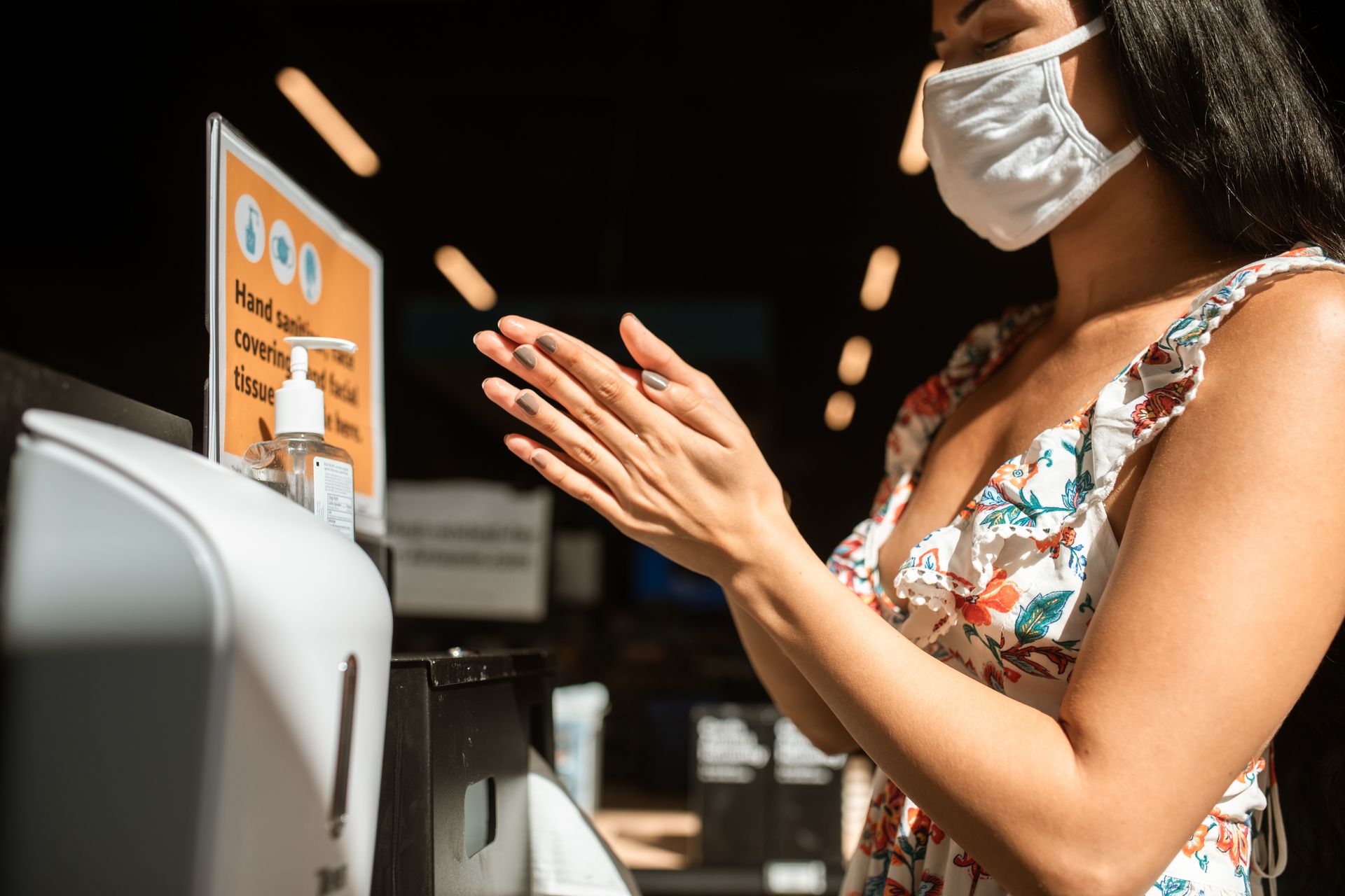 Woman Using A Hand Sanitizer