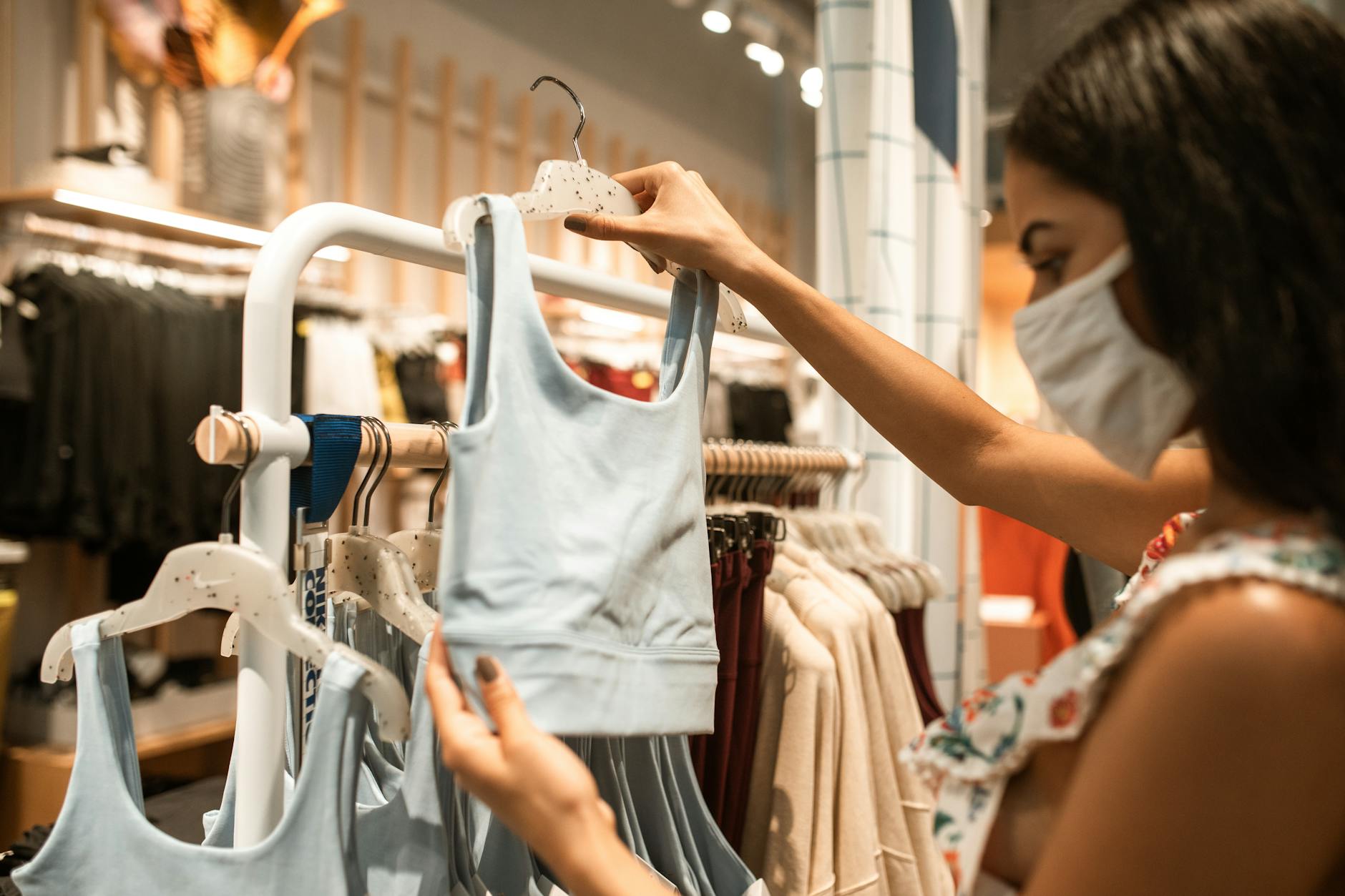 https://www.pexels.com/photo/woman-checking-on-a-sports-bra-5699248/