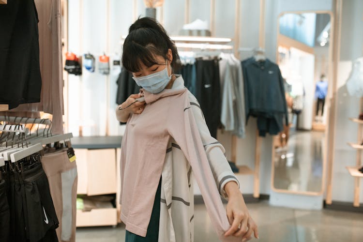 A Woman Fitting The Shirt