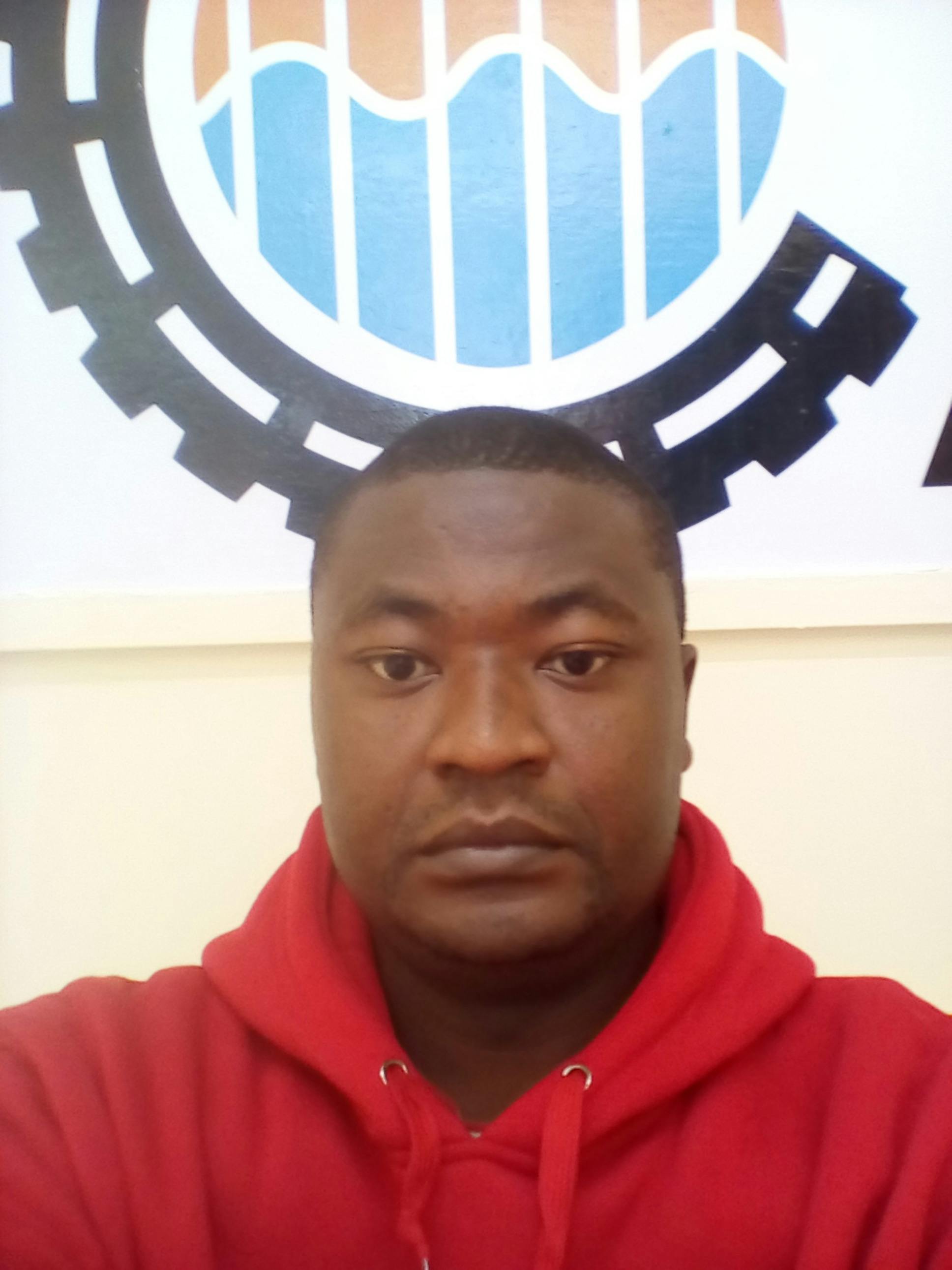 Nigerian couple looking at phone screen together checking PiggyVest savings withdrawal status Nigeria