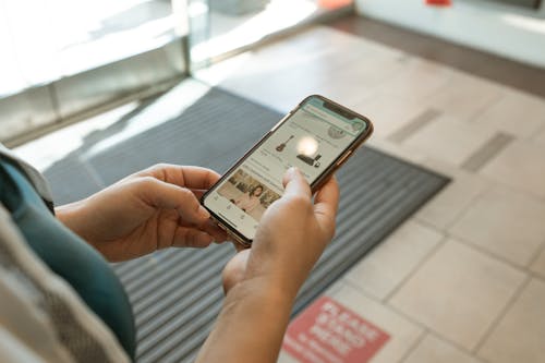 Close-Up Shot of a Person Holding an iPhone