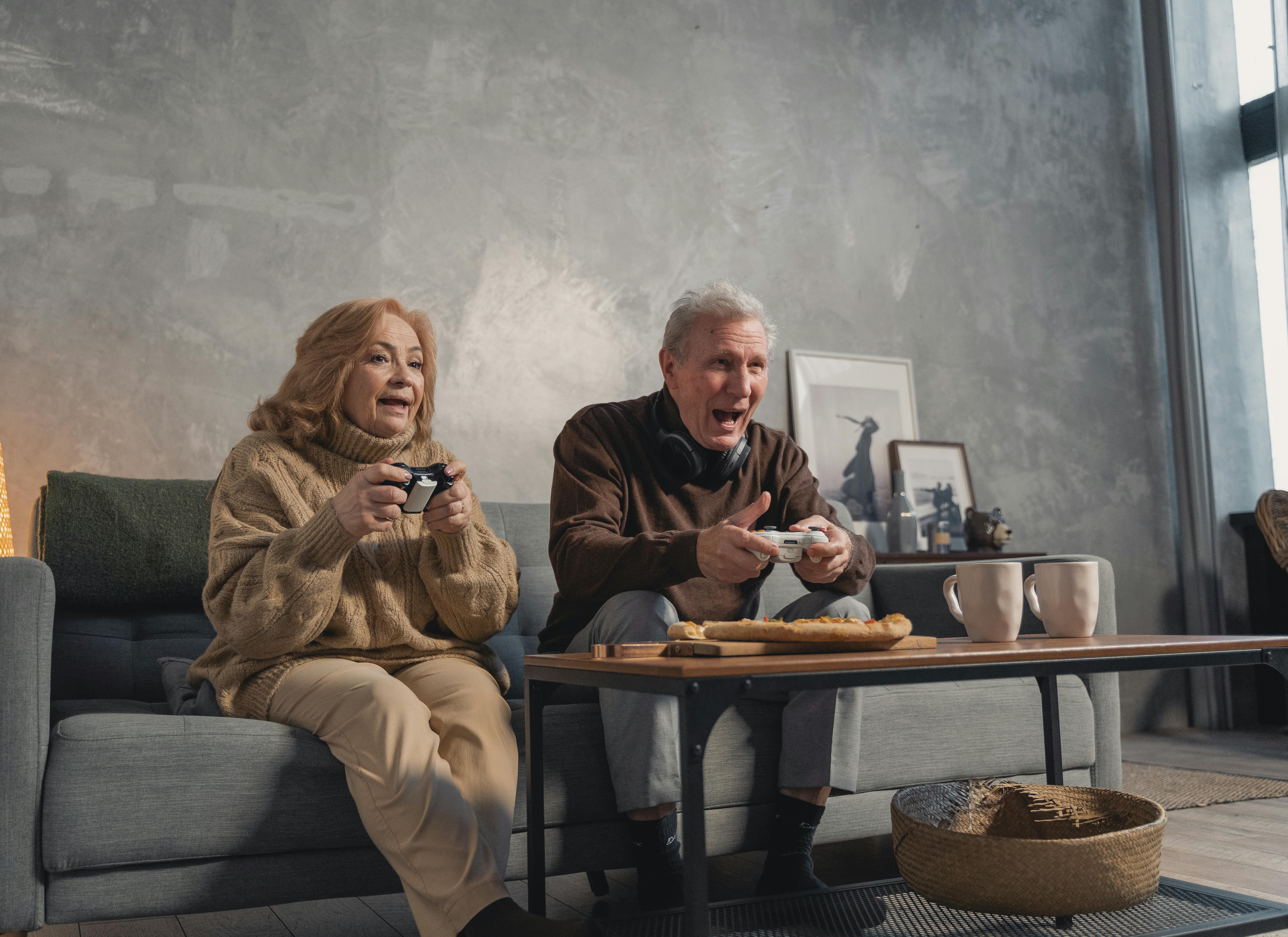 elderly couple sitting on the couch