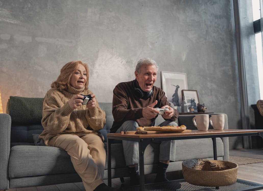 Elderly Couple Sitting on the Couch · Free Stock Photo