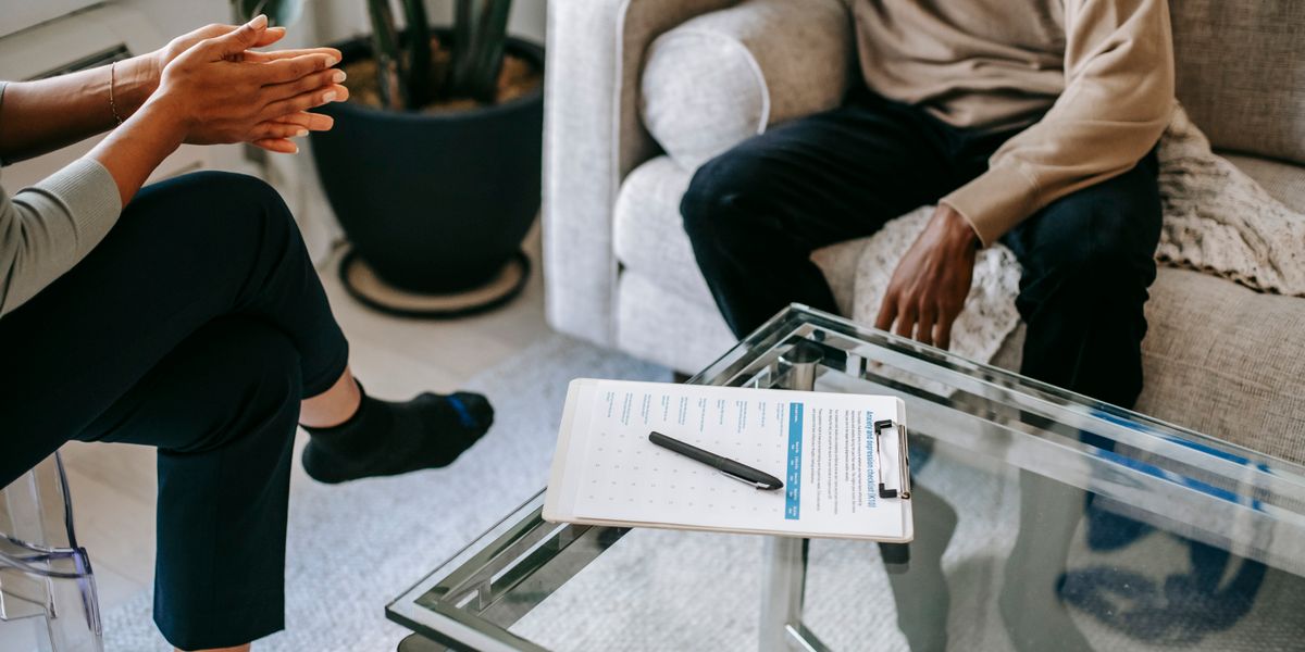 A person talking with a counsellor during a therapy session