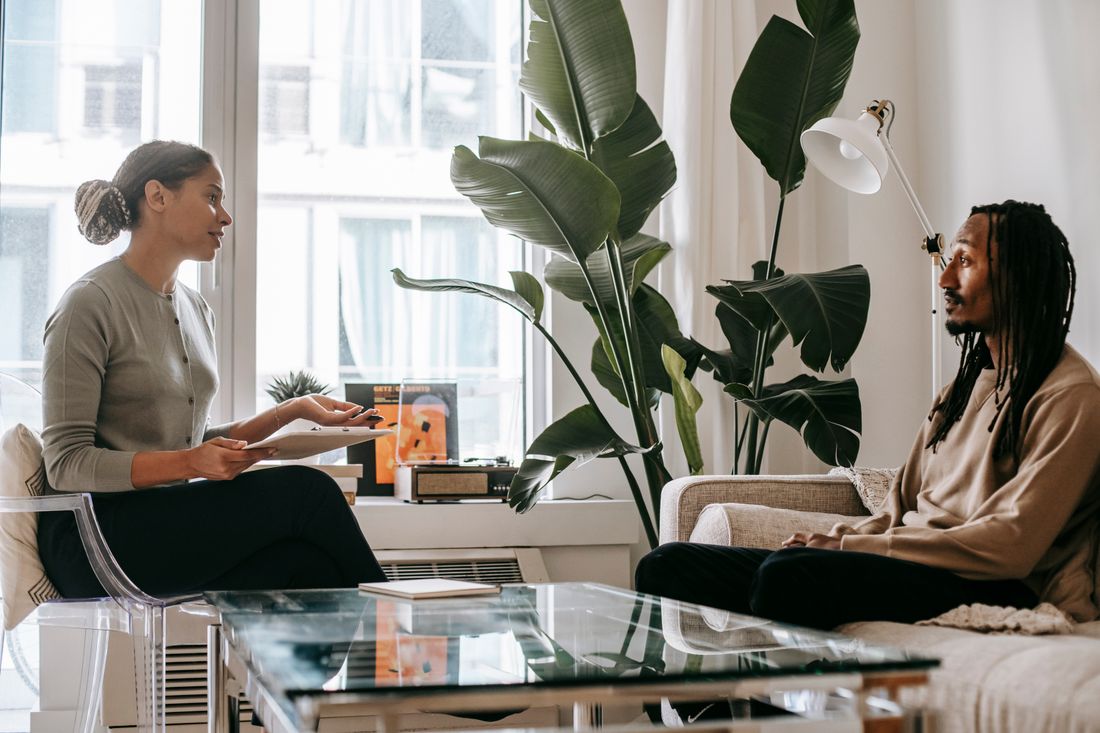 A mental health professional listening attentively during a private consultation