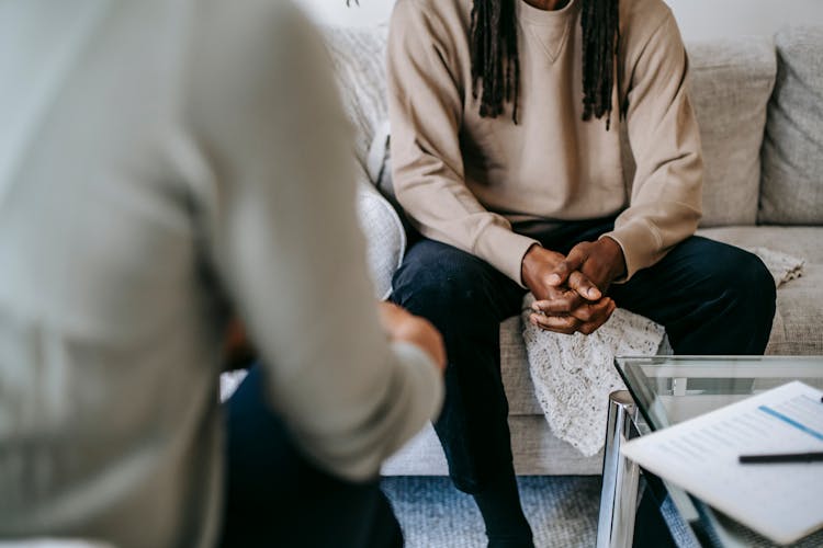 Crop Black Man Speaking With Psychologist