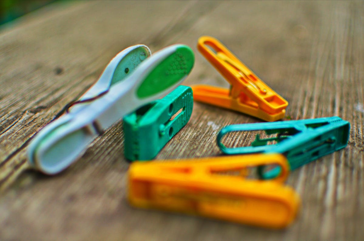 Person checking horoscope on a smartphone while using a laptop