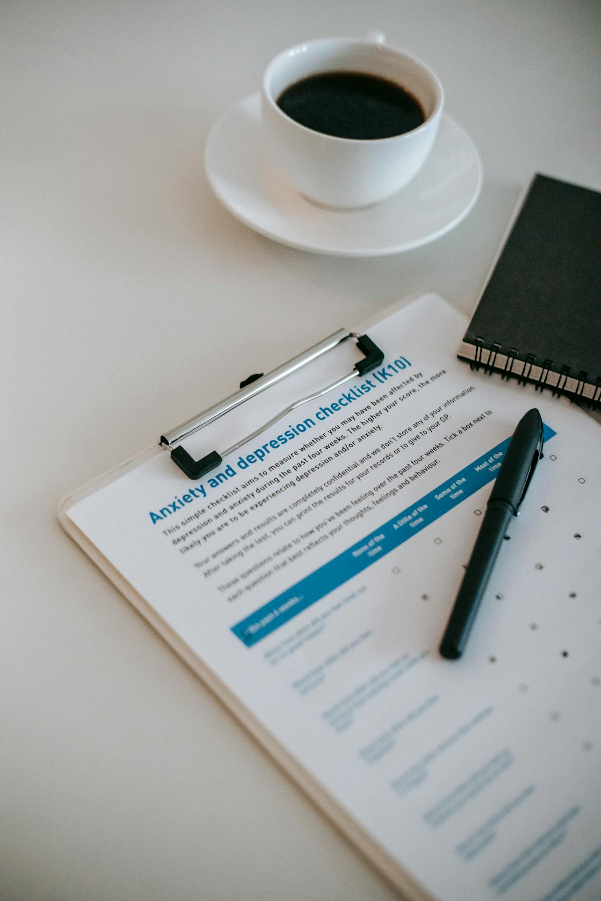 Nigerian man comparing loan options on smartphone in Abuja looking at Renmoney LAPO Accion MFB interest rates 2026