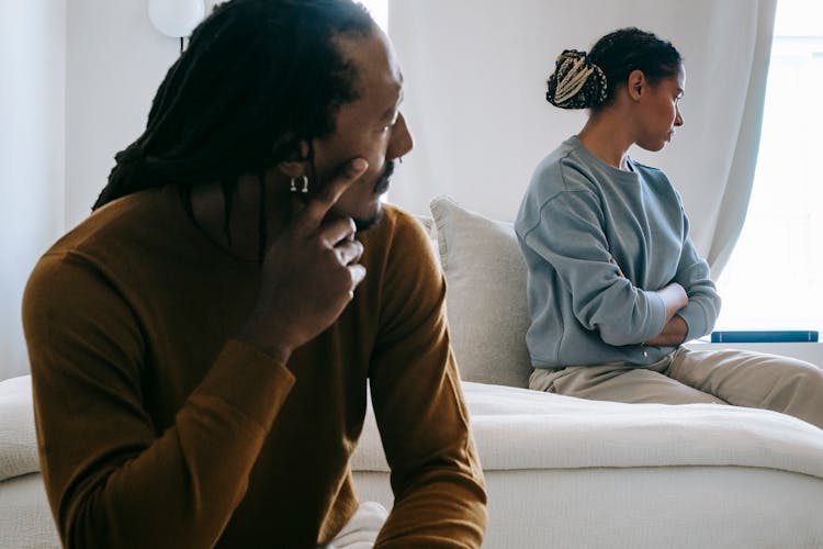 Black Couple Spending Time On Bed While Having Conflict